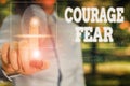 Conceptual hand writing showing Courage Fear. Business photo showcasing quality of mind that enables a demonstrating to