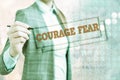 Conceptual hand writing showing Courage Fear. Business photo showcasing quality of mind that enables a demonstrating to face