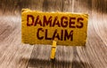 Conceptual hand writing showing Damages Claim. Business photo text Demand Compensation Litigate Insurance File Suit