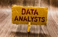 Conceptual hand writing showing Data Analysts. Business photo text Programmer Design and Create Report Identifies patterns Paper n Royalty Free Stock Photo