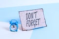 Conceptual hand writing showing Don T Forget. Business photo text used to remind someone about an important fact or detail Alarm Royalty Free Stock Photo