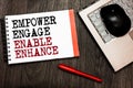 Conceptual hand writing showing Empower Engage Enable Enhance. Business photo showcasing Empowerment Leadership Motivation Engagem