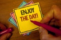 Conceptual hand writing showing Enjoy The Day Motivational Call. Business photo text Enjoyment Happy Lifestyle Relaxing Time Text