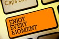 Conceptual hand writing showing Enjoy Every Moment. Business photo text being pleased with your life Have fun Precious time Button