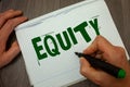 Conceptual hand writing showing Equity. Business photo text Value of a company divided into equal parts owned by shareholders Man