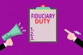 Conceptual hand writing showing Fiduciary Duty. Business photo showcasing A legal obligation to act in the best interest of other Royalty Free Stock Photo