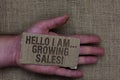 Conceptual hand writing showing Hello I Am... Growing Sales. Business photo text Making more money Selling larger quantities Cardb