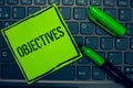 Conceptual hand writing showing Objectives. Business photo text Goals planned to be achieved Desired targets Company missions Keyb Royalty Free Stock Photo