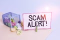 Conceptual hand writing showing Scam Alert. Business photo text fraudulently obtain money from victim by persuading him