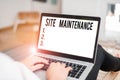 Conceptual hand writing showing Site Maintenance. Business photo text keeping the website secure updated running and bugfree Royalty Free Stock Photo