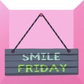 Conceptual hand writing showing Smile Friday. Business photo text used to express happiness from beginning of fresh week Wood