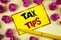 Conceptual hand writing showing Tax Tips. Business photo text Help Ideas for taxation Increasing Earnings Reduction on expenses Co