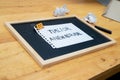 Conceptual hand writing showing Time For A New Normal, on white paperclip hold written chalkboard on wooden deck