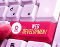 Conceptual hand writing showing Web Development. Business photo showcasing dealing with developing websites for hosting via