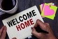 Conceptual hand writing showing Welcome Home. Business photo text Expression Greetings New Owners Domicile Doormat Entry Man holdi