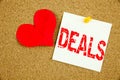 Conceptual hand writing text caption inspiration showing Deals concept for Advertising Deal and Love written on sticky note, remin