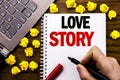 Conceptual hand writing text caption Love Story. Business concept for Loving Someone Heart Written on tablet laptop, wooden backg