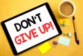 Conceptual hand writing text caption showing Don t Give Up. Business concept for Motivation Determination, Written on tablet lapto Royalty Free Stock Photo