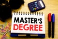 Conceptual hand writing text caption showing Master s Degree. Business concept for Academic Education written on notebook book on Royalty Free Stock Photo