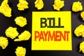 Conceptual hand writing text showing Bill Payment. Business concept for Billing Pay Costs written on sticky note paper. Folded yel