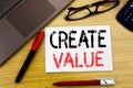 Conceptual hand writing text showing Create Value. Business concept for Creating Motivation written on paper, wooden background in Royalty Free Stock Photo