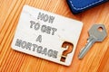 Conceptual hand written text showing HOW TO GET A MORTGAGE Royalty Free Stock Photo