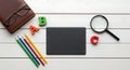 ABC Concept on White Wood with Pencils, Magnifying Glass, and Notepad Royalty Free Stock Photo