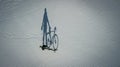 Conceptual image of bicyclist standing near by bike.