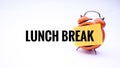 Conceptual image of Business Concept with words Lunch Break on a clock with a white background. Selective focus. Royalty Free Stock Photo