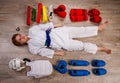 Conceptual image flat lay style of a little karateka girl surrounded by her equipment necessary for training and competition