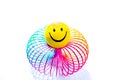 Smiley on a rainbow Slinky toy