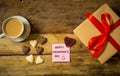 Conceptual image of Happy Saint valentines day with post it note, heart shaped chocolate and coffee Royalty Free Stock Photo