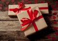 Conceptual image of Happy Saint valentines day wrapped gifts and red hearts on wooden vintage table