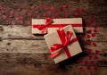 Conceptual image of Happy Saint valentines day wrapped gifts and red hearts on wooden vintage table