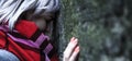 Conceptual image: hopelessness, depression, anxiety and frustration. Stressed woman leans on the wall. Copy space