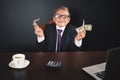 Conceptual image King of Banks. Successful banker holding money Royalty Free Stock Photo