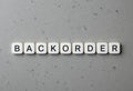 Conceptual Image of Letters Spelling Backorder on Gray Background Royalty Free Stock Photo