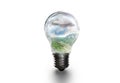 Conceptual image of a light bulb with a landscape inside