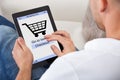 Conceptual image of a man making an online purchase Royalty Free Stock Photo