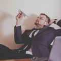 Conceptual image: professional burnout, laziness, unwillingness to work. Close up portrait of slacker businessman sitting in Royalty Free Stock Photo