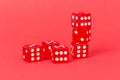 Transparent and red glass dices isolated on red background