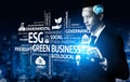 Conceptual image representing ESG principles in green business strategy, featuring a businessman with technological Royalty Free Stock Photo