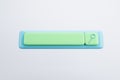 conceptual image of a search bar with a loupe, cast in soft green and blue tones. Technology concept.