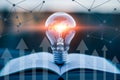 Light bulb idea concept on book with network connection and arrows for innovation and growth Royalty Free Stock Photo