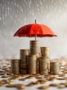 Conceptual image of stacked gold coins protected by a red umbrella from falling rain drops symbolizing financial security and Royalty Free Stock Photo