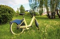 Conceptual image of travel. Bicycle in a green summer field