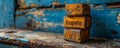 Conceptual image of vintage wooden blocks stacked with the word Empathy on a rustic table against a worn blue wall, depicting