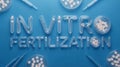 In Vitro Fertilization IVF Text Art with Petri Dishes and Pipettes on Blue Royalty Free Stock Photo