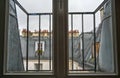 Conceptual image of a window on a rainy day: close-up image of the glass with rain drops, in the background blurred the view of Royalty Free Stock Photo