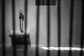 Conceptual jail photo with iron nail sitting behind bars artistic conversion